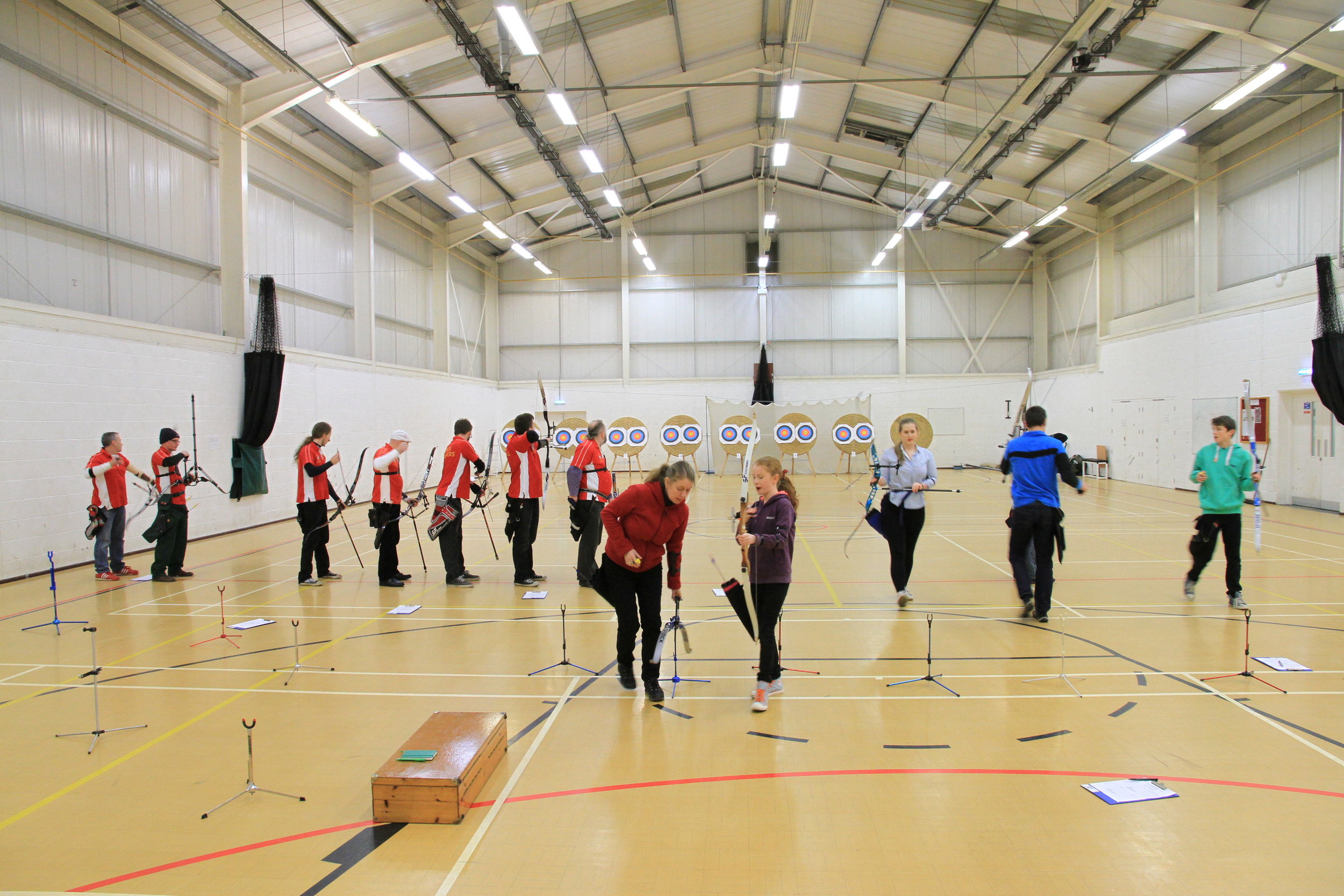 Archers shooting at indoor targets in the Askham Bryan College sports hall
