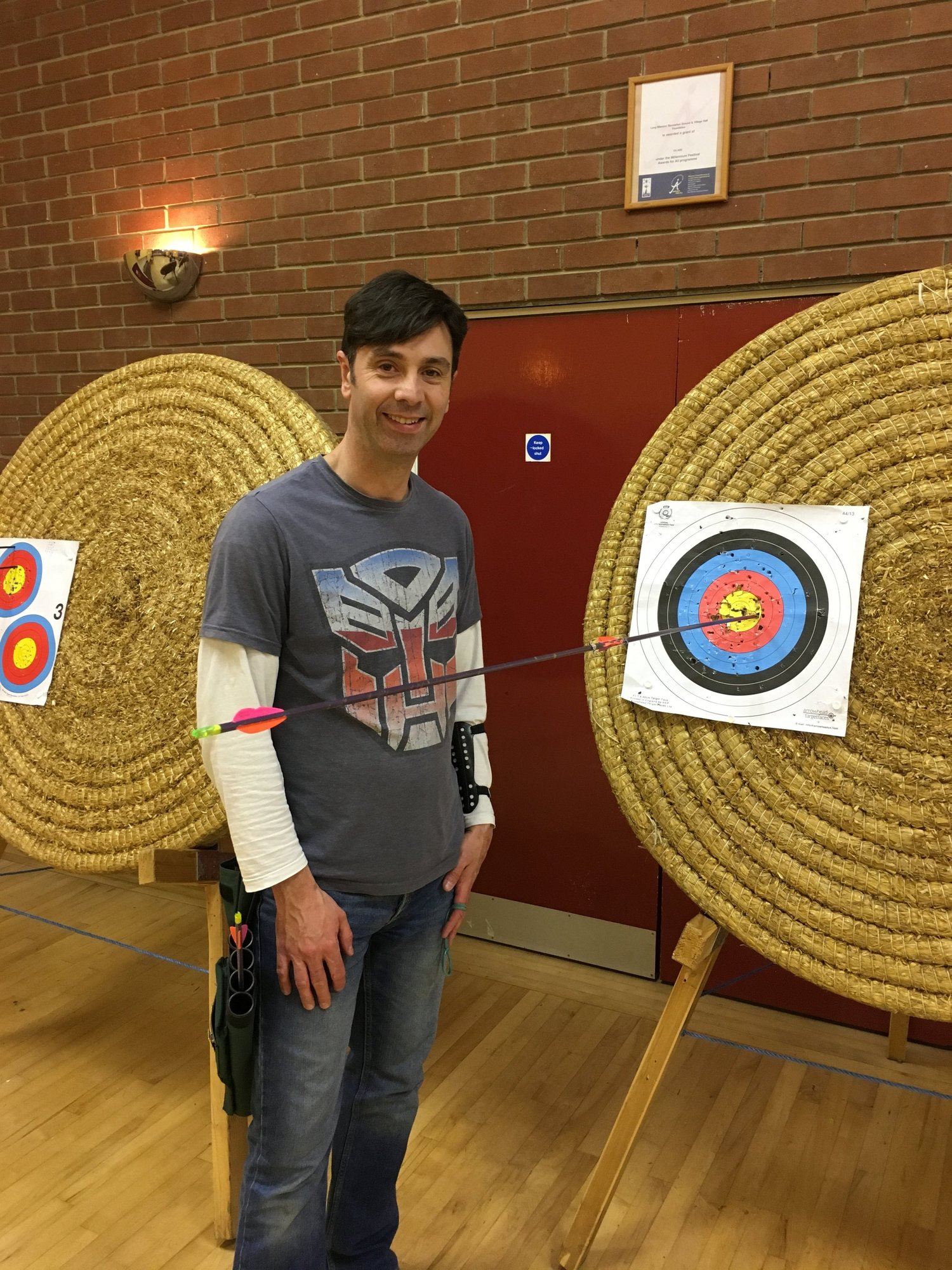 An arrow split perfectly down the shaft of another arrow in a target, a robin hood shot by Pete Todman
